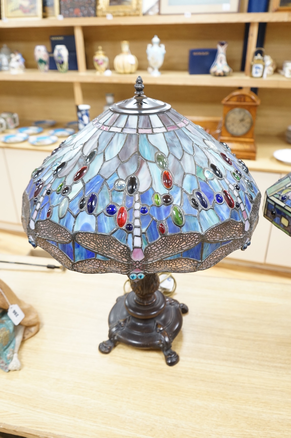 Two Tiffany style table lamps, with ornate glass and metal shades, tallest 72cm high